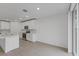 Open concept kitchen with white cabinets and island at 3166 Viceroy Ct, Poinciana, FL 34759