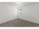 Spacious bedroom with neutral carpeting and window at 3166 Viceroy Ct, Poinciana, FL 34759