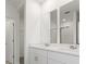 Double vanity bathroom with large mirrors at 3166 Viceroy Ct, Poinciana, FL 34759