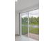 Sliding glass door opens to a view of water and trees at 3166 Viceroy Ct, Poinciana, FL 34759