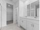 Modern bathroom with double vanity and walk-in shower at 3170 Viceroy Ct, Poinciana, FL 34759