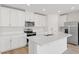 Modern kitchen with stainless steel appliances and an island at 3170 Viceroy Ct, Poinciana, FL 34759
