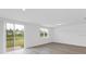 Living room with sliding glass doors and view of pond at 3170 Viceroy Ct, Poinciana, FL 34759