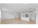 Open concept kitchen and living room with island and white cabinets at 3170 Viceroy Ct, Poinciana, FL 34759