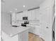 Modern kitchen with white cabinets and quartz countertops at 3170 Viceroy Ct, Poinciana, FL 34759