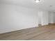 Bright living room with hardwood floors and access to hallway at 3170 Viceroy Ct, Poinciana, FL 34759