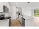 Bright kitchen featuring stainless steel appliances and an island at 3170 Viceroy Ct, Poinciana, FL 34759