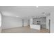 Open concept living and kitchen area with tile flooring at 3150 Viceroy Ct, Poinciana, FL 34759