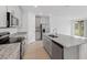 Modern kitchen with gray cabinets and granite counters at 3150 Viceroy Ct, Poinciana, FL 34759