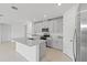 Modern kitchen featuring granite countertops and stainless steel appliances at 3150 Viceroy Ct, Poinciana, FL 34759