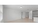 Open living area with kitchen view and tile floors at 3150 Viceroy Ct, Poinciana, FL 34759