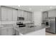 Modern kitchen with gray cabinets and granite countertops at 3150 Viceroy Ct, Poinciana, FL 34759