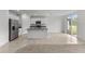 Modern kitchen with stainless steel appliances and granite island at 3206 Viceroy Ct, Poinciana, FL 34759