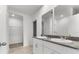 Bathroom with double vanity, granite countertop, and walk-in shower at 3206 Viceroy Ct, Poinciana, FL 34759