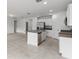 Modern kitchen with stainless steel appliances and an island at 3206 Viceroy Ct, Poinciana, FL 34759