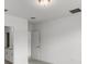 Simple bedroom with a door to the bathroom at 3206 Viceroy Ct, Poinciana, FL 34759