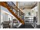 Grand staircase with ornate railing and hardwood treads at 2417 Alaqua Dr, Longwood, FL 32779