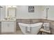 Spa-like bathroom with a freestanding soaking tub at 2417 Alaqua Dr, Longwood, FL 32779