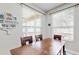 Charming dining area with wood table and chairs, lots of natural light at 8544 Greenbank Blvd, Windermere, FL 34786