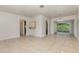 Open dining room with tile floors and access to kitchen at 1916 Colton Dr, Orlando, FL 32822