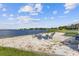 Lakefront sandy beach with fire pit and seating at 4113 Fairview Vista Pt # 308, Orlando, FL 32804