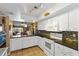 Kitchen features white cabinets, tile backsplash, and stainless steel appliances at 4113 Fairview Vista Pt # 308, Orlando, FL 32804