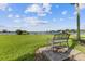 Scenic lake view with a peaceful bench for relaxation at 4113 Fairview Vista Pt # 308, Orlando, FL 32804