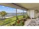 Relaxing screened porch with lake view and lush greenery at 4113 Fairview Vista Pt # 308, Orlando, FL 32804