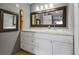 Bright bathroom with white vanity and a decorative shower curtain at 4113 Fairview Vista Pt # 308, Orlando, FL 32804