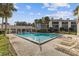 Community pool with lounge chairs and patio area at 4113 Fairview Vista Pt # 308, Orlando, FL 32804