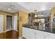 Kitchen with double sink, view into living room, and white cabinets at 4113 Fairview Vista Pt # 308, Orlando, FL 32804