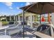 Community patio with tables, chairs, and grill at 4113 Fairview Vista Pt # 308, Orlando, FL 32804