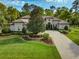 Luxury home exterior with landscaping at 213 Arezzo Ct, Sanford, FL 32771