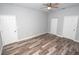Spacious bedroom with wood-look floors and ceiling fan at 4455 Se 24Th St, Ocala, FL 34471