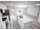 Open concept kitchen with island and stainless steel appliances at 4455 Se 24Th St, Ocala, FL 34471