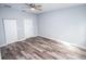 Spacious bedroom with wood-look floors and ceiling fan at 4455 Se 24Th St, Ocala, FL 34471