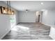 Bright living room with wood-look floors and sliding glass doors at 4455 Se 24Th St, Ocala, FL 34471
