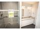 Bathroom with walk-in shower and double vanity at 4455 Se 24Th St, Ocala, FL 34471