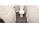 Small bathroom with toilet and dark tile floor at 4455 Se 24Th St, Ocala, FL 34471