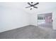 Spacious bedroom with grey carpet and access to the patio at 15639 Greater Groves Blvd, Clermont, FL 34714