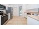Modern kitchen with stainless steel appliances and light cabinets at 15639 Greater Groves Blvd, Clermont, FL 34714