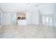 Open living room and kitchen area with tile flooring at 15639 Greater Groves Blvd, Clermont, FL 34714
