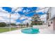 Inviting screened-in pool with a view of the neighborhood at 15639 Greater Groves Blvd, Clermont, FL 34714