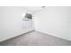 Bright bedroom featuring grey carpet and a window at 15639 Greater Groves Blvd, Clermont, FL 34714