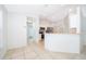 Modern kitchen with white cabinets and breakfast bar at 15639 Greater Groves Blvd, Clermont, FL 34714