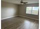 Spacious living room featuring light gray wood-look floors at 2406 W Orange Blvd, Kissimmee, FL 34741