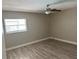 Well-lit bedroom with ceiling fan and neutral wall colors at 2406 W Orange Blvd, Kissimmee, FL 34741