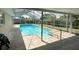 Screened-in pool with a spacious deck area at 2406 W Orange Blvd, Kissimmee, FL 34741