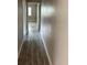 Bright hallway with light gray wood-look flooring at 2406 W Orange Blvd, Kissimmee, FL 34741