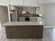 Modern kitchen with stainless steel appliances and large island at 2406 W Orange Blvd, Kissimmee, FL 34741